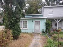 Charming exterior view of house number 7 with muted green siding and cozy front yard at 7 Century St. # 7, Myrtle Beach, SC 29577