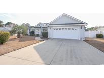 Charming single-story home featuring a two-car garage and well-maintained landscaping at 793 Drawbridge Dr., Conway, SC 29526