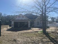 New construction home with visible framing, and covered with weather resistant Dryline material at 126 Palm Dr., Loris, SC 29569