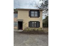 Two-story home featuring wood siding, stone accents, and a front entrance at 1513 Poplar Dr. S # A, Surfside Beach, SC 29575