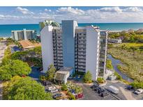 Stunning aerial view of the high-rise condo building overlooking the beach, ocean, and waterway at 311 69Th Ave. N # 505, Myrtle Beach, SC 29572