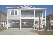 Beautiful coastal home featuring a classic beach-style exterior and inviting front porch at 326 46Th Ave. N, North Myrtle Beach, SC 29582