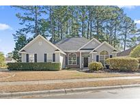 Charming single-story home with well-maintained landscaping and traditional architectural details at 4801 New Haven Ct., Myrtle Beach, SC 29579