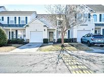 Charming home with a one car garage and lush landscaping, complemented by a quaint covered entry at 6095 Catalina Dr. # 1614, North Myrtle Beach, SC 29582