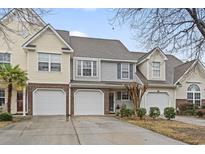 Charming townhome featuring attached garages and welcoming curb appeal at 1024 Stanton Pl. # 1024, Myrtle Beach, SC 29588