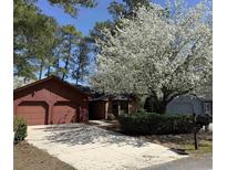 Inviting home featuring an attached two car garage and charming curb appeal at 120 Juneberry Ln., Conway, SC 29526