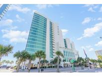 Stunning exterior view of a high-rise building in a coastal setting, showcasing its modern architectural design at 201 S Ocean Blvd. # 717, Myrtle Beach, SC 29577