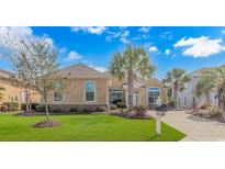 Beautiful single-story home with well-manicured lawn and lush landscaping and inviting curb appeal at 2212 Via Palma Dr., North Myrtle Beach, SC 29582