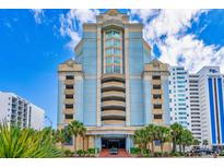 Stunning exterior view of a modern condo building with blue and beige facade and palm trees at 2501 S Ocean Blvd. # 923, Myrtle Beach, SC 29577