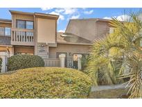 Charming condo exterior featuring well-maintained landscaping and a balcony, exuding a cozy and inviting curb appeal at 617 14Th Ave. S # 83, Surfside Beach, SC 29575