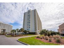 Spacious high-rise condominium featuring multiple balconies and well-maintained landscaping at 9820 Queensway Blvd. # 1206, Myrtle Beach, SC 29572