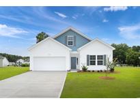 Charming two-story home with a blue accent above the garage and a well-manicured lawn at 495 Wagner Cir., Conway, SC 29526