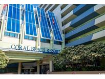 Exterior of Coral Beach Resort with modern architecture and manicured landscaping in a beach town setting at 1105 S Ocean Blvd. # 1106, Myrtle Beach, SC 29577