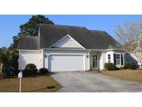 Charming single-story home featuring a well-maintained lawn, attached garage, and classic curb appeal at 1307 Chelsea Ln., Longs, SC 29568
