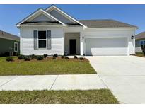 Charming single-story home with manicured lawn and attached two-car garage in desirable neighborhood at 8628 Farrier Dr., Myrtle Beach, SC 29588
