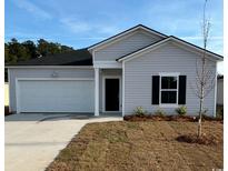 Charming single-story home with a one car garage and simple, low maintenance landscaping at 1356 Palm Springs Paloma Dr, Longs, SC 29568