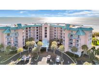 Beautiful beachfront condo with palm trees and convenient parking at 145 South Dunes Dr. # 503, Pawleys Island, SC 29585