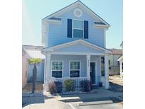 Charming two-story home with a welcoming porch and neat landscaping at 259 19Th Ave. S, Myrtle Beach, SC 29577