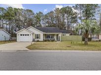 Charming single story home with manicured lawn, attached garage and covered front porch at 945 Castlewood Dr., Conway, SC 29526