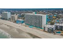 Beautiful oceanfront condo building with pools and beach access, perfect for a relaxing vacation at 1210 N Waccamaw Dr. # 1105, Murrells Inlet, SC 29576