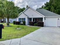 Charming single-story home with well-maintained landscaping and an attached garage at 248 Upper Saddle Circle, Conway, SC 29526