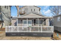 Charming gray cottage with white-railed porch, perfect for relaxing and enjoying the outdoors at 6001-5124 S Kings Hwy., Myrtle Beach, SC 29575