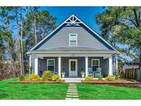 Charming single story home featuring a well manicured lawn and inviting front porch area at 624 Blackberry Ave., Murrells Inlet, SC 29576