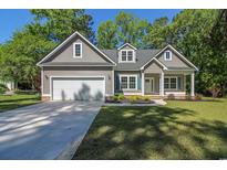 Charming single Gathering home with a two car garage, and a cozy front porch at 839 Francis Parker Rd., Georgetown, SC 29440