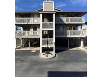 Condo with multiple balconies and covered parking on the ground floor at 1800 N Ocean Blvd. # P1, North Myrtle Beach, SC 29582