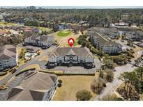 An aerial view of a beautiful condominium complex set on a golf course with a view of the ocean at 2241 Waterview Dr. # 425, North Myrtle Beach, SC 29582