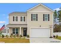 Charming two-story home with tan siding, dark shutters, and an attached two-car garage at 380 Harvest Ridge Way, Conway, SC 29527