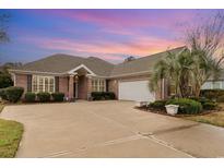 Beautiful red brick home with well-maintained landscaping, large driveway and attached two car garage at 951 Foxtail Dr., Longs, SC 29568