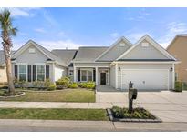 Charming single-story home with a manicured lawn, black shutters, one-car garage, and inviting curb appeal at 1178 Shire Way, Myrtle Beach, SC 29577