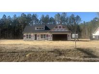 New construction home showing framed walls and windows awaiting exterior finishing at 2925 Hughes Gasque Rd., Aynor, SC 29511