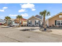Charming single-story homes with colorful exteriors and well-maintained landscaping on a sunny day at 4350 Grande Harbour Blvd., Little River, SC 29566