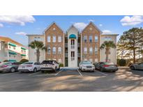 Attractive condo complex with brick and siding exterior and well-maintained landscaping at 9754 Leyland Dr. # 11, Myrtle Beach, SC 29572