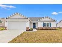 Charming single-story home featuring a pristine white exterior, blue door and shutters, and an attached two-car garage at 235 Six Mile Creek Dr., Georgetown, SC 29440