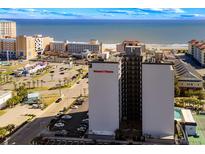 Coastal condominium building with ocean view, nearby restaurants, shopping, and amenities at 601 Mitchell Dr. # 801, Myrtle Beach, SC 29577