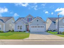 Charming single-Gathering home featuring a well-manicured lawn and an attached two-car garage at 6366 Chadderton Circle, Myrtle Beach, SC 29579