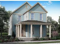 Charming two-story home with a welcoming front porch and light blue siding at 738 Macon Alley, Myrtle Beach, SC 29588