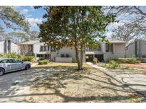 Charming townhouse with a mature tree in the front yard and private parking at 276 Salt Marsh Circle # 4D, Pawleys Island, SC 29585