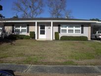 Charming single-story home with tidy landscaping, black shutters, and a brick and vinyl facade at 3752 Tea Rose St. # 3752, Myrtle Beach, SC 29577