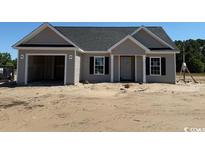 Charming single-story home featuring a garage, neutral siding, and classic black shutters at 1280 Highway 45, Loris, SC 29569