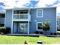 Two story condo featuring a balcony and sliding glass doors offering outdoor access at 1356 Glenns Bay Rd. # 202L, Surfside Beach, SC 29575