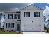 Charming two-story home featuring a white exterior, black shutters, and a two-car garage at 238 Bald Cypress Way, Conway, SC 29527