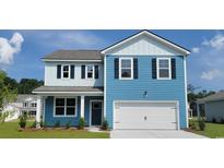Charming two-story home featuring blue siding, black shutters, and an attached two-car garage at 371 Rookroost Circle, Conway, SC 29526