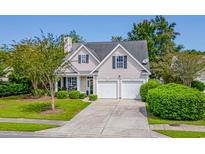Charming home features two-car garage, landscaped lawn, mature trees, and inviting curb appeal at 2009 Chadbury Ln., Myrtle Beach, SC 29588