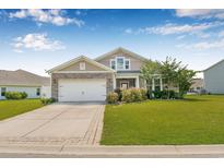 Charming single-Gathering home with a two-car garage, well-maintained lawn, and stone and siding facade at 256 Copper Leaf Dr., Myrtle Beach, SC 29588