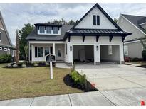 Charming two-story home with a two-car garage and manicured front yard at 5009 Middelton View Dr., Myrtle Beach, SC 29579