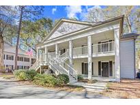 Charming two-story condo with a welcoming front porch and beautiful landscaping at 95 Weehawka Way # 2, Pawleys Island, SC 29585